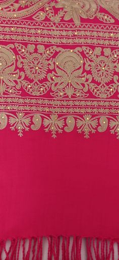 Elegant classy gorgeous embroidered shawl /wrap. Made by hand to the highest quality. This elegant shawl can wear to any occassions. Colour: bright pink  with gold embroidery                 and gold stones throughout  Length: 80 inches  Width: 32 inches  Dry clean only Elegant Pink Dupatta With Intricate Embroidery, Intricate Embroidered Shawl For Wedding, Intricately Embroidered Wedding Shawl, Festive Pashmina Shawl With Embroidered Border, Intricate Embroidered Wedding Shawl, Traditional Wedding Pashmina Shawl With Embroidered Border, Festive Gold Shawl With Motifs, Gold Bohemian Shawl For Wedding, Elegant Pink Embroidered Fabric For Festive Occasions