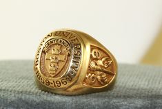 This ring is so impressive.  It is a 28.4 gram solid 14K yellow gold Class Ring.  It denotes the Centennial of Boston University 1869-1969.   The ring is size 10 1/2 and could be sized by your local jeweler.  It is a special heritage ring and well worth passing on to family. Antique Gold Signet Ring For Commemoration, Gold Antique Signet Ring For Commemoration, Gold Engraved Ring With Maker's Mark, Collectible, Classic Gold Signet Ring For Commemoration, Vintage Gold Engraved Ring With Maker's Mark, Gold Signet Ring With Polished Finish For Collectors, Gold Heirloom Engraved Ring Collectible, Heirloom Gold Engraved Ring For Commemoration, Vintage Yellow Gold Signet Ring Collectible