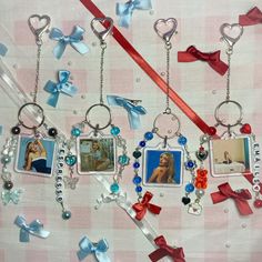 several key chains with pictures and charms attached to them on a checkered table cloth