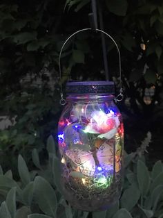 a jar filled with lots of colorful lights