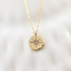 "This gorgeous gold star compass necklace will be a favorite with grads. She will love to wear this as a reminder to pursue her dreams with confidence. The necklace is made with a sparkling gold plated over brass hammered pendant with cubic zirconia accents for a little extra sparkle. The pendant measures approximately 1/2\" and hangs on a 14K gold filled cable chain in length of your choice. Necklace comes packaged on a custom gift card and boxed ready for gifting. ♥ ♥ ♥ Check out more necklace Adjustable Necklace With Star Charm, Spiritual Necklaces With Star Charm As Gift, Star-shaped Engraved Necklace For Gift, Star-shaped Compass Necklace As Gift, Star-shaped Compass Necklace As A Gift, Star-shaped Compass Necklace Gift, Star-shaped Compass Design Necklace For Gift, Star-shaped Compass Design Necklace As Gift, Adjustable Compass Design Necklace For Gift