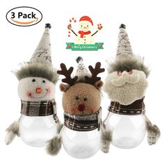 three snowmen with hats and scarfs on their heads are sitting in glass jars