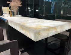 a marble table with chairs around it