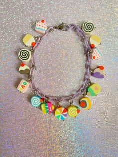 If you love desserts and cute jewelry, then this kawaii sweets charm bracelet is a great addition to your style! So many sweets included 😍 #kawaiijewelry #kawaiibracelet #charmbracelet #cutejewelry #cutebracelet #etsyjewelry #sweetsjewelry Cute Multicolor Jewelry With Lobster Clasp, Kawaii Dangle Earrings For Birthday, Cute Purple Charm Bracelet For Friendship, Sweet White Jewelry With Cute Design, White Kawaii Charm Bracelet Gift, Cute Multicolor Charm Bracelet For Jewelry Making, Cute Dangle Charm Bracelet, Cute Purple Beaded Bracelets For Birthday, Cute Dangle Charm Bracelet With Lobster Clasp