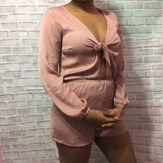 Lovely Light Pink Romper With A Tie & Key Hole Detail In The Front. Long Sleeve But Light Weight, So This Can Definitely Be Worn Throughout The Year! Casual Or Dressy! Pink Romper, Pink Rompers, Forever 21 Pants, Key Hole, Pant Jumpsuit, Jumpsuit Romper, Light Pink, The Year, Forever 21