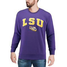 Your loyalty to the LSU Tigers will be on full display when you put on this amazing Arch and Logo sweatshirt from Colosseum. Brand: Colosseum Crew neck Imported Long sleeve Machine wash, tumble dry low Material: 70% Cotton/30% Polyester Officially licensed Sizing Tip: Product runs large. We recommend ordering one size smaller than you normally wear. Cotton Tops With Ribbed Cuffs For Fan Merchandise, Purple Crew Neck Top For College, Purple Crew Neck Fan Gear Top, Purple Crew Neck Top For Fan Gear, Crew Neck Tops With Lettering For Fan Gear, Crew Neck Tops With Lettering For Fans, Lsu Tigers, Put On, Ncaa