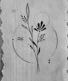 a black and white photo of a flower on a piece of paper with circles around it