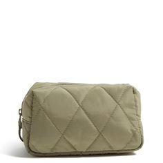 a beige quilted bag on a white background with clippings to the side