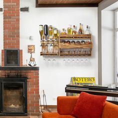 a living room filled with furniture and a fire place in front of a brick fireplace