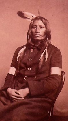 an old black and white photo of a native american man