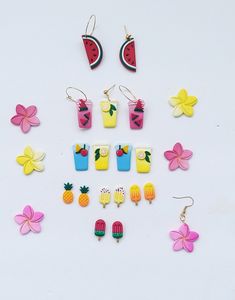 the earrings are made out of polymer and have different designs on each earring, including watermelon