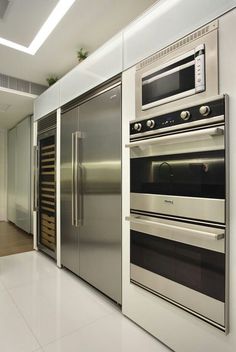 a kitchen with stainless steel appliances and cabinets