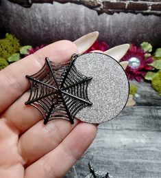 "These earrings feature lightweight charms. Laser cut spiderwebs have been placed over silver glitter disks to highlight their design and beauty. They have silver plated ear wires. Earrings are 2 1/2\" Long and 1 1/2\" wide *Color may vary slightly due to camera flash or individual computer monitors Store policies: https://www.etsy.com/shop/eternalnightboutique#policies Back to the shop: https://www.etsy.com/shop/eternalnightboutique" Silver Witchy Earrings For Party, Silver Witchy Party Earrings, Witchy Silver Earrings For Halloween, Web Spider, Dagger Necklace, Spider Jewelry, Spider Necklace, Spider Halloween, Jewelry Halloween