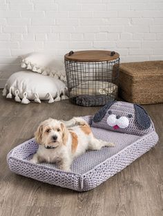 a dog laying on top of a bed in the middle of a room with stuffed animals