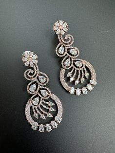 This Dangle & Drop Earrings item is sold by Merake. Ships from Hackettstown, NJ. Listed on Apr 11, 2023 Indian Jhumka, Flower Jewelry Designs, Beautiful Jewelry Diamonds, Rose Gold And Silver, Indian Jewellery Design Earrings, Indian Jewellery Design, Bollywood Jewelry, Jewelry Design Earrings, American Diamond