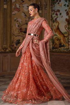 Juliet enchants with a printed silk bodice and a sequinned net peshwaas, finished with a graceful 5-yard net dupatta. A perfect union of raw silk elegance and shimmering details. Floor-length Sequined Dupatta For Eid, Designer Sequined Organza Anarkali Set, Floor-length Net Sharara With Sheer Dupatta, Designer Organza Anarkali Set With Sequins, Traditional Drape Organza Gown With Sequins, Organza Saree Gown With Sequins, Traditional Drape Net Dress With Sheer Dupatta, Anarkali Style Pre-draped Saree With Sequins For Festive Occasions, Festive Pre-draped Net Saree In Traditional Shape