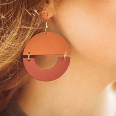 All the fun of big, bold geometric earrings with none of the weight! the Details ﻿- 3" drop x 2" W Bold Geometric Earrings With Bold Design, Bold Geometric Designed Earrings, Bold Geometric Earrings, Modern Orange Earrings For Everyday Wear, Bold Drop Earrings With Bold Design, Trendy Bold Design Earrings, Bold Handmade Geometric Earrings, Trendy Brown Circular Earrings, Trendy Brown Circle Earrings