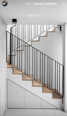 a staircase with wooden steps and metal railings