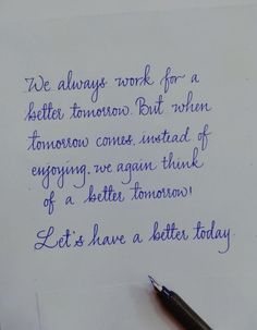 a handwritten note from a person who is writing something on paper with blue ink