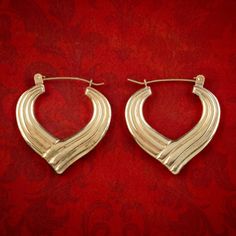 A beautiful pair of vintage creole earrings from the late 20th Century fashioned in a muted 9ct yellow gold with deep grooves engraved down a curvaceous, hoop gallery. They'd make a perfect gift and are held in place by lever back wires at the top.  WEIGHT: 1.9 grams   MEASURE: Height 26mm x Width 25mm x Depth 2mm METAL: 9ct Gold (Tested) AGE: Circa 1970 CONDITION: Very Good ITEM NUMBER: 23-815 We provide Free Worldwide Shipping for this item. Interest Free Layaway and Finance Payment Options ar Hair Locket, Hair Bracelet, Creole Earrings, Locket Bracelet, Pink Topaz, Snake Ring, Antique Earrings, Diamond Cluster Ring, Gold Polish