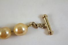 "Carolee faux champagne color glass baroque pearl necklace Measures 17 inches long gold vermeil over sterling toggle style clasp the pearls are 1/2\" wide and long Excellent condition on beads" Formal Antique Pearl Drop Necklace, Gold Pearl Bracelet With Pearl Charm For Formal Occasions, Antique Gold Jewelry With Pearl Charm, Gold Single Strand Baroque Pearl Jewelry, Antique Gold Pearl Chain Necklace, Adjustable Gold Pearl Necklace With Lobster Clasp, Elegant Gold Pearl Necklace With Lobster Clasp, Gold Single Strand Pearl Bracelet For Formal Occasions, Gold Pear-shaped Single Strand Pearl Necklace