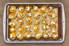 there are many appetizers on the baking sheet