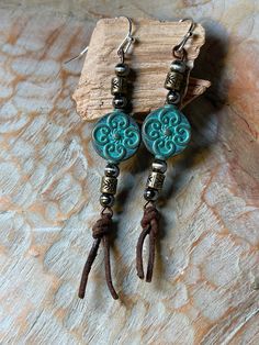 Beautiful Turquoise metal bead with bronze, leather and silver embellishments. Fun to wear and lightweight! Adjustable Bohemian Patina Earrings, Bohemian Turquoise Hand-tooled Earrings, Adjustable Turquoise Beaded Copper Earrings, Bohemian Turquoise Concho Earrings, Bohemian Concho Earrings For Festival, Blue Bohemian Hand-tooled Earrings, Adjustable Turquoise Concho Earrings, Pom Crafts, Leather Jewelry Making