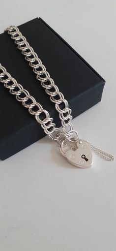 "925 Sterling Silver DOUBLE Curb Bracelet 7.5\" This Sterling Silver Double Curb chain bracelet is ideal for showcasing medium charms. Comes with Heart Padlock & Safety Chain. Available in widths of 4.5mm and 6.5mm. Length: 7.5\". Width: 4.5mm  Length: 7.5\"/19cm This Double Curb chain is 4.5mm wide and each link is approximately 4.7mm in length.  Weight: 5.6g. Width: 6.5mm Length: 7.5\"/19cm **HALLMARKED This Double Curb chain is 6.5mm wide and each link is approximately 6.5mm in length.  Due t Charm Bracelet Silver, Heart Padlocks, Silver Chain Style, Safety Chain, Tiny Stud Earrings, Silver Charm Bracelet, Gold Filled Earrings, Keep Jewelry, Minimalist Necklace