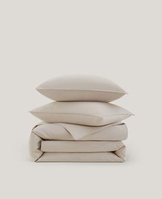 four pillows stacked on top of each other