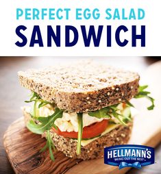 an egg salad sandwich on a cutting board with the words, perfect egg salad sandwich