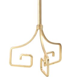 a pair of gold earrings hanging from a metal hook on a white background with clippings