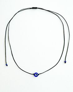 Evil eye choker necklace, String choker, Minimalist The evil eye is used to protect the person that wears it from the malevolent look of others who envy or dislike that person. The necklace is made with 1mm black waxed string,and has a 8mm blue glass evil eye bead. At the end it is adorned with seed beads. Total length: 80cm / 31 inches It is adjustable to fit a lot of sizes. Custom orders for different colour combinations are welcome. Other necklaces in my shop: https://www.etsy.com/shop/LuckyR Adjustable Evil Eye Spiritual Jewelry, Adjustable Spiritual Evil Eye Jewelry, Handmade Adjustable Eye-shaped Jewelry, Bohemian Adjustable Eye-shaped Jewelry, Bohemian Eye-shaped Adjustable Jewelry, Adjustable Bohemian Eye-shaped Jewelry, Adjustable Evil Eye Jewelry Gift, Adjustable Evil Eye Jewelry For Gift, Evil Eye Choker Necklace As Gift