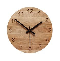 a wooden clock with black hands and numbers on it