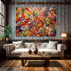 a living room with a couch, coffee table and large painting on the wall above it