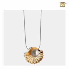 The Sea Shell Pearl Gold Vermeil pendant is the perfect gift for a loved one, or for one’s self. It can carry meaning, as it allows the wearer to place a small bit of ashes or another small item into the center of the pendant. The exterior of the pendant is graced in a gold vermeil, which means it is given a delicate layer of gold placed atop the 925 sterling silver from which the necklace is made. The scalloped edges of the sea shell give it added detail, as the inner layers are etched and text Minimal Necklace, Silver Snake Chain, Cremation Jewelry, Scalloped Edges, Sea Shell, Matte Gold, Pearl Pendant, Pearl White, Gold Vermeil