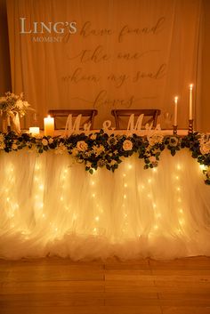 the table is decorated with candles and flowers