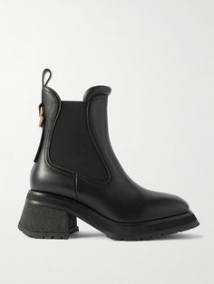 Moncler refreshes the classic Chelsea boots with flared lines and gold-tone logo hardware in this leather 'Gigi' style. Set on 70mm block heels, they have traditional elasticated side panels and substantial rubber-lug soles for reliable grip in any weather. Sweden Clothing, Gigi Style, Moncler Women, Shoes Boots Ankle, Sports Skirts, Black Chelsea Boots, Boot Pumps, Leather Chelsea Boots, Fine Jewelry Designers