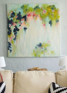 a painting on the wall above a couch