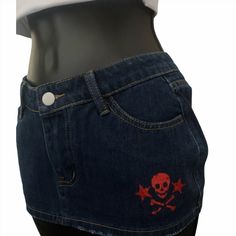 Dark denim color drop waist mini skirt with red glitter skull and star, lips and skull design.  68% Cotton, 16% Polyester, 14% Viscose.  The Christmas delivery cutoff date was Nov. 28th, after that I cannot guarantee arrival by Christmas. There can be slight difference in size of design by 1-3 inches. New skirt design since May 2024 as a result of customer feedback that the original skirt was too short. Please look at the size guide in the last slide, this is a MINI SKIRT so it will be short and you will likely want to wear microshorts underneath. Punk Style Mini Denim Skirt For Summer, Grunge Mini-length Bottoms For Streetwear, Grunge Mini Denim Skirt For Streetwear, Punk Denim Skirt For Summer Streetwear, Summer Punk Streetwear Denim Skirt, Summer Punk Denim Skirt For Streetwear, Fitted Grunge Mini Skirt For Streetwear, Grunge Style Mini Skirt For Club, Y2k Mini Skirt For Streetwear