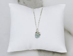 This 100% natural raw aquamarine stone necklace would be a perfect birthday gift for a March birthday or a bridesmaid, Mom, or any loved one. The aquamarine stone represents tranquility, serenity, clarity, and harmony. You can also add more birthstone stones to this necklace to represent each family member. Click here for the cascade version: https://www.etsy.com/listing/1056765229/raw-stone-necklace-custom-birthstone?ref=shop_home_active_1&pro=1&frs=1Choose from a plated chain or an 18k Delicate Charm Necklaces With Natural Stones For Gift, Delicate Charm Necklace With Natural Stones For Gifts, Delicate Natural Stones Charm Necklace For Gift, Dainty Silver Birthstone Crystal Necklace, Minimalist Amazonite Jewelry Gift, Minimalist Aquamarine Jewelry For Gift, Minimalist Aquamarine Jewelry Gift, Handmade Amazonite Crystal Necklace Gift, Amazonite Pendant Necklace For Gift