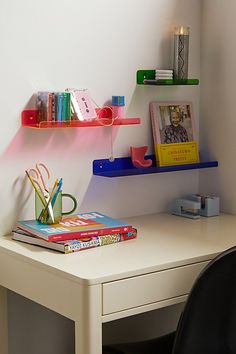 a white desk with some books on it