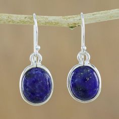 Majestic blue lapis lazuli ovals hang alluringly from silver wires. Matta crafts earrings of classic minimalism to exalt the lovely gem. .925 Sterling silver