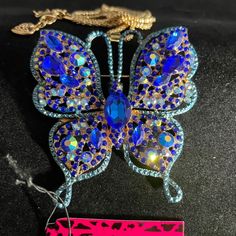 New Betsey Johnson Rhinestone Embellished Blue Butterfly Necklace Betsey Johnson Chain Length: 27.5" Betsey Johnson Medal Heart Hang Tag Betsey Johnson Is An American Fashion Designer Best Known For Her Feminine And Whimsical Designs. Many Of Her Designs Are Considered "Over The Top" And Embellished. She Also Is Known For Doing A Cartwheel At The End Of Her Fashion Shows. From Wikipedia Please Email Me For Additional Photos, Details, Or Questions Many Blessings Shella Kate Blue Butterfly Necklace, American Fashion Designers, Betsey Johnson Jewelry, American Fashion, Butterfly Necklace, Over The Top, Fashion Shows, Blue Butterfly, Hang Tags