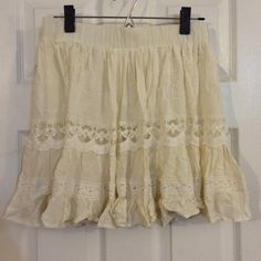 Dainty Beige vintage looking skirt NWT New with tags. Beige color with an under layer. Size medium. Forever 21 Skirts Beige Skirt With Lace Trim For Spring, Beige Bottoms With Lace Trim Flowy Design, Summer Beige Skirt With Lace Trim, Beige Lace Trim Skirt For Spring, Bohemian Cotton Mini Skirt For Day Out, Cream Flared Skirt For Summer, Summer Mini Skirt With Lace Trim, Bohemian Short Mini Skirt For Spring, Cream Ruffled Mini Skirt For Summer