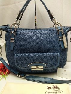 Coach Kristin Ltd Ed Denim Woven Leather Round Satchel Shoulder Bag 100% authentic New with tag MSRP: $1200 Features: * Material:  leather in denim blue * Size: large * Measurements (L x H x W): 15" x 13" x 4.5" * Silvertone hardware * Coach leather hangtag * Zip-top closure * Satin lining inside * Inside zipper and open pockets * Leather handles with 6" drop * Crossbody strap with 20" drop * Come with dustbag Exterior: brand new but has some small scratches on the leather as shown in the pictur Woven Leather Bag, Coach Leather, Leather Handles, Zip Top, Denim Blue, Crossbody Strap, Leather Handle, Bags Handbags, Leather Bag