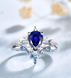 an engagement ring with blue and white stones