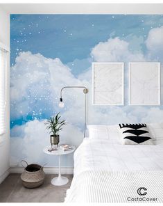 the bedroom is decorated in white and blue with stars on the sky wallpapers