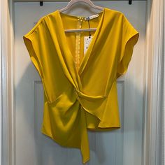 Cheerful Sophisticated Short Sleeved Blouse With Modern Accented Front Twist, With Classic Zipper On Back Of Blouse. Yellow V-neck Top For Party, Elegant Yellow V-neck Top, Chic Sleeveless Blouse For Office, Sleeveless Blouse For Office In Spring, Chic Sleeveless Office Blouse, Elegant Yellow Formal Tops, Elegant Yellow Summer Blouse, Elegant Yellow Blouse For Evening, Elegant Yellow Evening Blouse