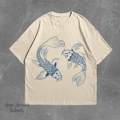 1x Koi Fish T-Shirt Our shirts come in unisex sizing and are produced from the finest quality materials, making them incredibly soft and cozy! The high-quality print on our T-shirt features beautiful colors and detailing, ensuring the design stands out beautifully against the fabric. The print is durable, resistant to fading, and offers a long-lasting, premium look and feel. Size - True to size (Comfort fit) - Sizes from small to XXL - For an oversized fit, size up 1-2 sizes from your normal size - Unisex fit (Looser fit for women) Designs Different colors available, see pictures for references. Made using 100% US cotton that is ethically grown and harvested.  Care Instructions Machine wash: cold (max 30C or 90F). Do not bleach, tumble dry or dry clean. Do not iron directly on print. Other Graphic Fish Print Short Sleeve T-shirt, Fish Print Crew Neck Graphic Tee, Graphic Fish Print T-shirt With Short Sleeves, Graphic Tee T-shirt With Fish Print, Graphic Tee With Fish Print And Crew Neck, Graphic Tee With Fish Print Short Sleeve, Cotton Short Sleeve T-shirt With Fish Print, Casual Cotton T-shirt With Fish Print, Casual Crew Neck T-shirt With Fish Print