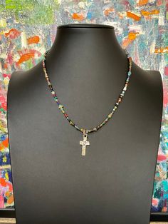 Handmade sterling silver cross with heart on handmade sterling jump ring. Beaded necklace loaded with gemstones and ancient stones. Custom options available. Original design every necklace is one of a kind artesian jewelry. Perfect gift for someone you love or yourself! 18" Free gift of the month for purchases over $35. Exclusive Studio design All jewelry is handmade, in studio.  Therefore, there may be a 1-3 mm difference in the listed length and adjustable lengths. If you require a precise mea Multicolor Beaded Cross Jewelry, Beaded Cross Pendant For Jewelry Making, Handmade Artisan Sterling Silver Beaded Necklace, Spiritual Beaded Cross Pendant Necklace, Handmade Sterling Silver Beaded Necklace, Cross Necklace With Silver Beads For Gift, Silver Cross Jewelry With Beads, Unique Handmade Sterling Silver Beaded Necklace, Adjustable Cross Jewelry With Natural Stones